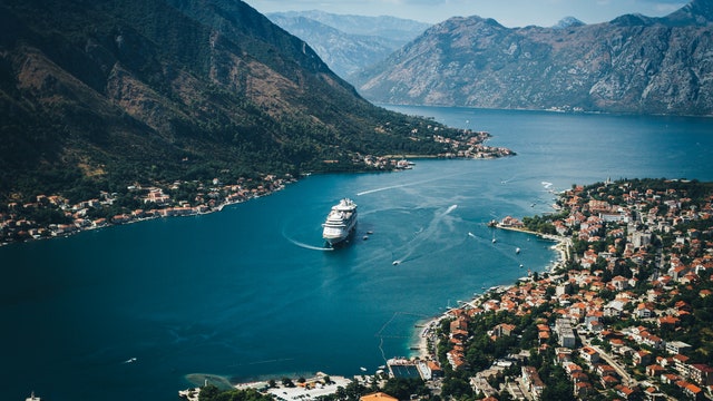 Aerial View of Kotor bay. Cruise ship docked in beautiful summer day.