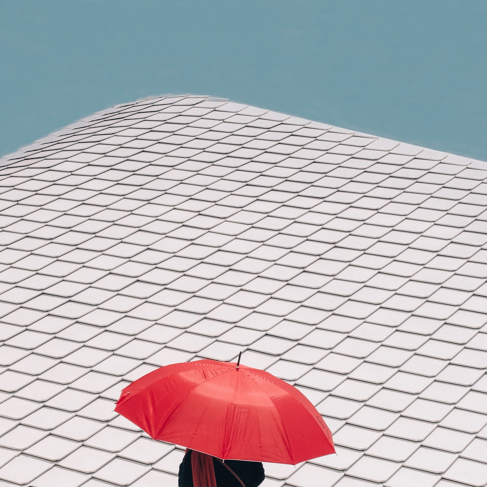 Red Umbrella Against Blue Sky